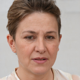 Joyful white adult female with short  brown hair and brown eyes