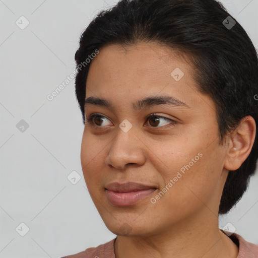 Joyful latino young-adult female with short  brown hair and brown eyes