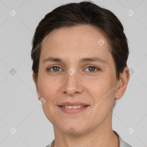 Joyful white adult female with short  brown hair and brown eyes