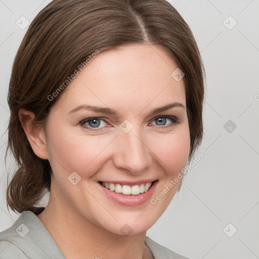 Joyful white young-adult female with medium  brown hair and blue eyes