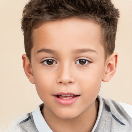 Joyful white child male with short  brown hair and brown eyes