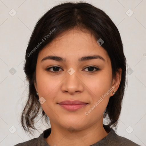 Joyful latino young-adult female with medium  brown hair and brown eyes