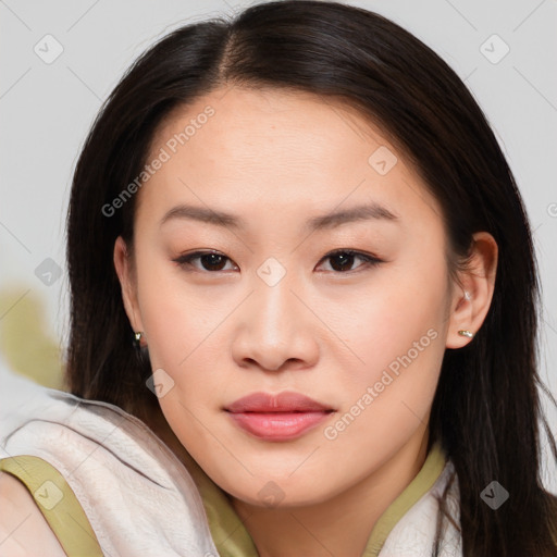 Joyful asian young-adult female with long  brown hair and brown eyes