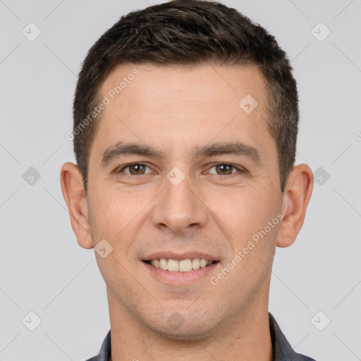 Joyful white young-adult male with short  brown hair and brown eyes