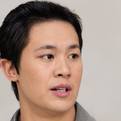 Neutral asian young-adult male with short  black hair and brown eyes