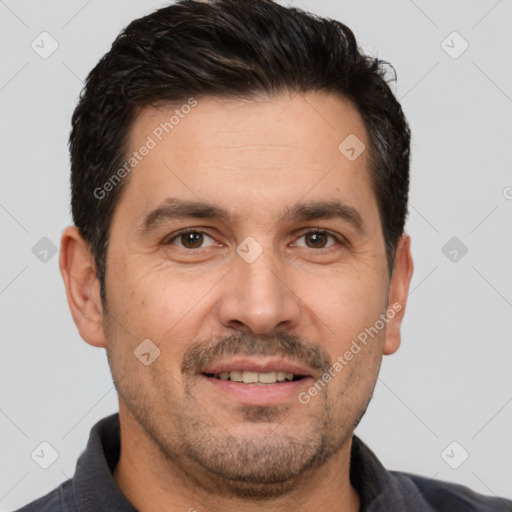 Joyful white adult male with short  brown hair and brown eyes