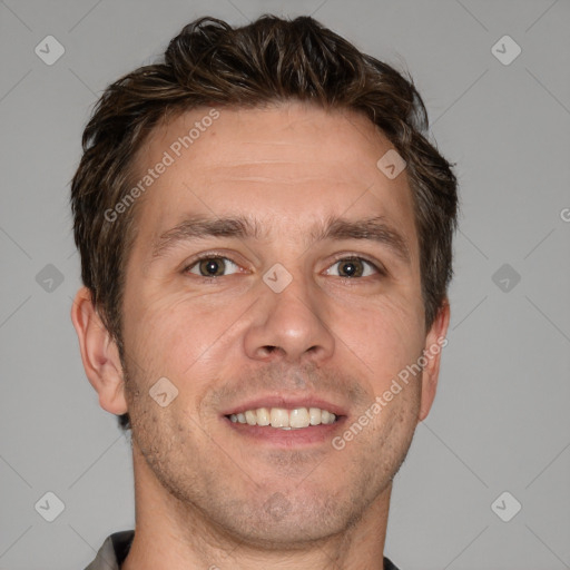 Joyful white adult male with short  brown hair and brown eyes