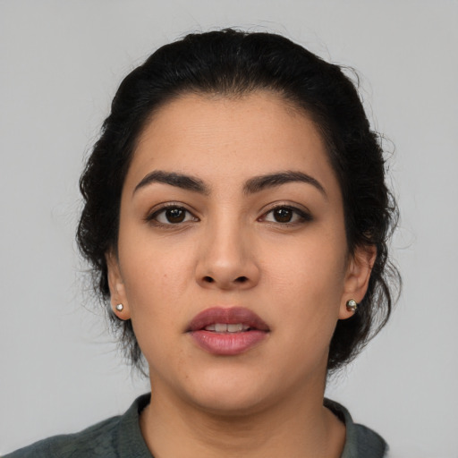 Neutral latino young-adult female with medium  black hair and brown eyes
