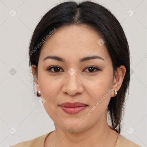 Joyful latino young-adult female with medium  brown hair and brown eyes