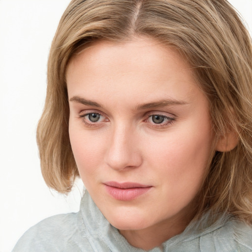 Neutral white young-adult female with long  brown hair and blue eyes