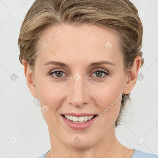 Joyful white young-adult female with medium  brown hair and blue eyes