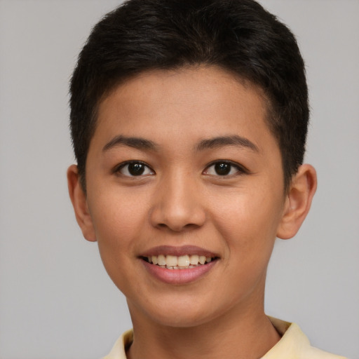 Joyful asian young-adult female with short  brown hair and brown eyes