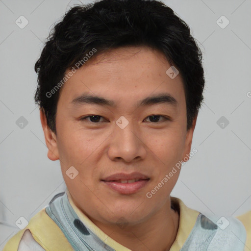 Joyful asian young-adult male with short  brown hair and brown eyes