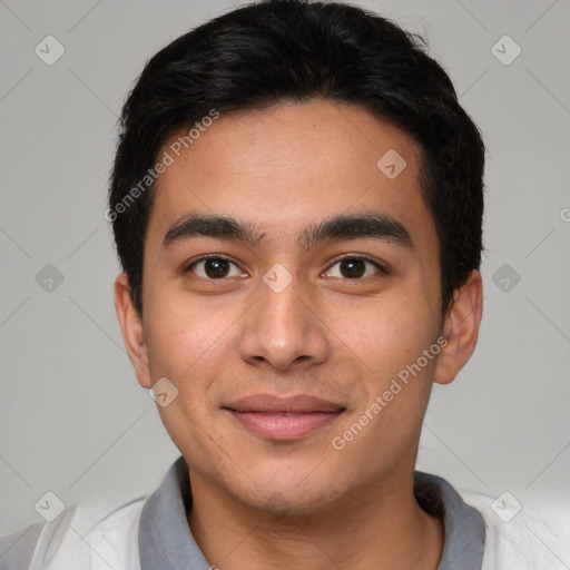 Joyful white young-adult male with short  black hair and brown eyes