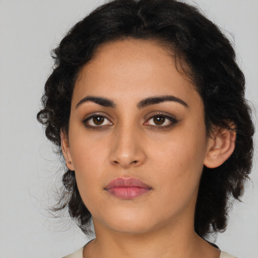 Neutral latino young-adult female with long  black hair and brown eyes