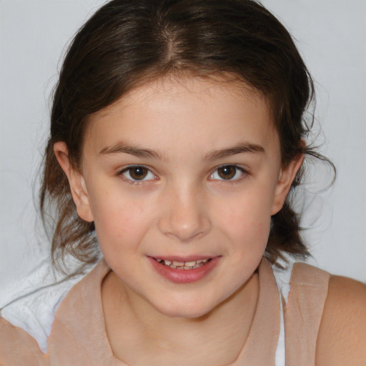 Joyful white child female with medium  brown hair and brown eyes