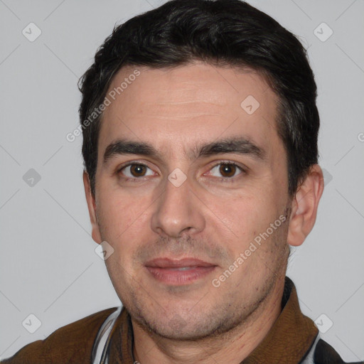 Joyful white adult male with short  black hair and brown eyes