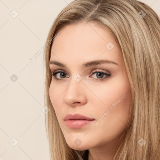 Neutral white young-adult female with long  brown hair and brown eyes