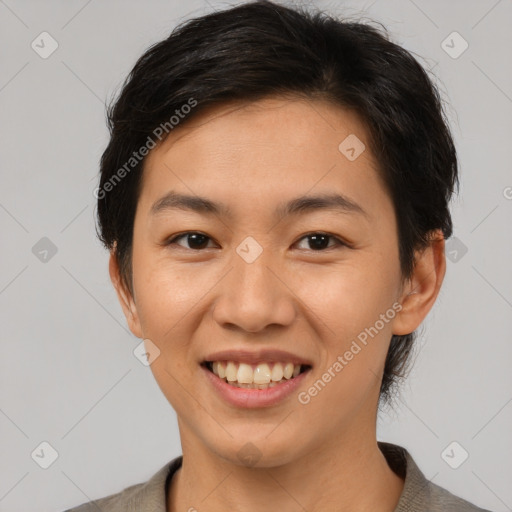 Joyful asian young-adult female with short  brown hair and brown eyes