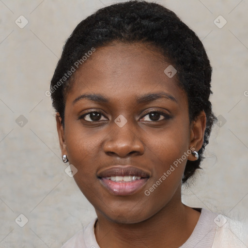 Joyful black young-adult female with short  black hair and brown eyes