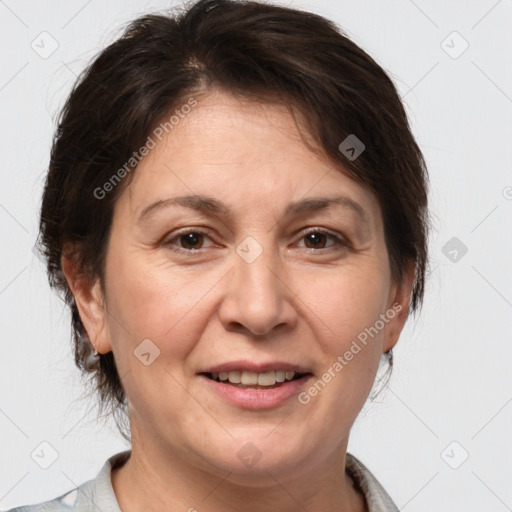 Joyful white adult female with medium  brown hair and brown eyes