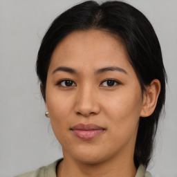 Joyful asian young-adult female with medium  brown hair and brown eyes