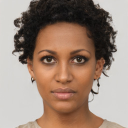 Neutral black young-adult female with short  brown hair and brown eyes