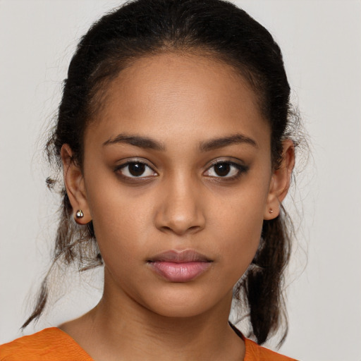 Neutral latino young-adult female with medium  brown hair and brown eyes