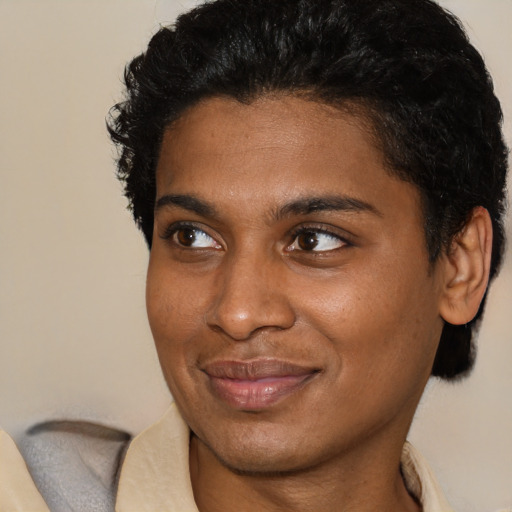 Joyful latino young-adult female with short  brown hair and brown eyes