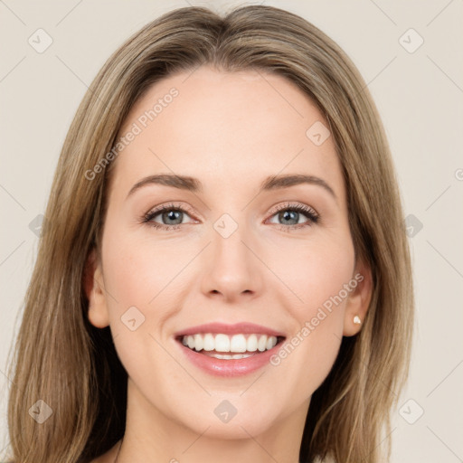 Joyful white young-adult female with long  brown hair and green eyes