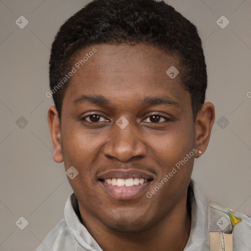 Joyful black young-adult male with short  brown hair and brown eyes