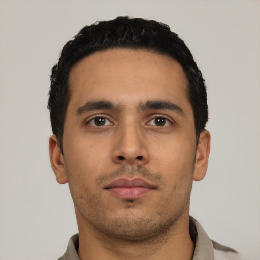 Neutral latino young-adult male with short  black hair and brown eyes