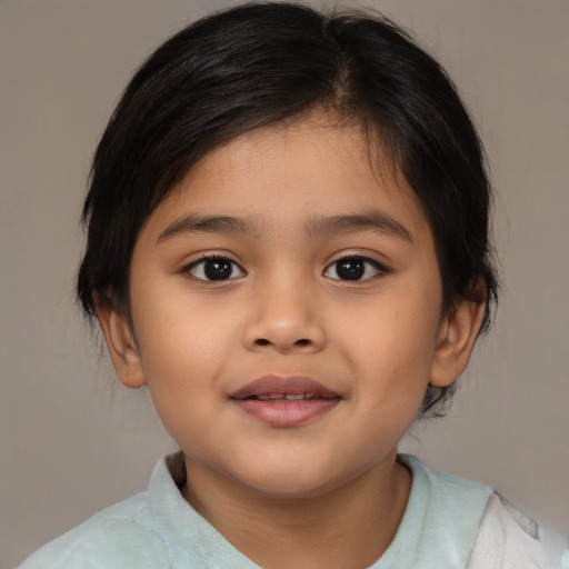 Joyful asian child female with medium  brown hair and brown eyes