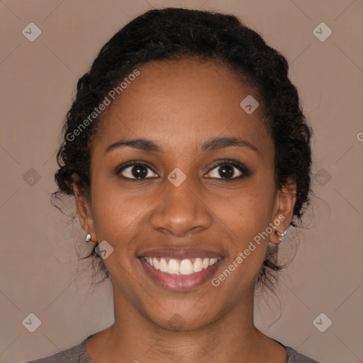 Joyful black young-adult female with medium  brown hair and brown eyes