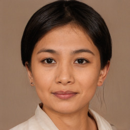 Joyful asian young-adult female with medium  black hair and brown eyes