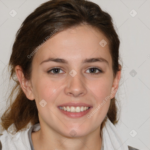 Joyful white young-adult female with medium  brown hair and blue eyes