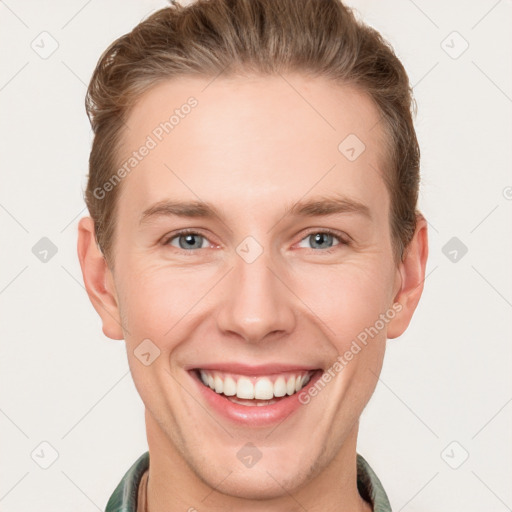 Joyful white young-adult male with short  brown hair and grey eyes