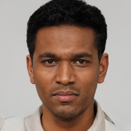Neutral black young-adult male with short  black hair and brown eyes