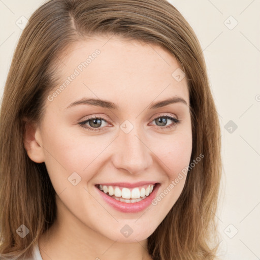 Joyful white young-adult female with long  brown hair and green eyes