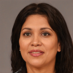 Joyful white adult female with medium  brown hair and brown eyes