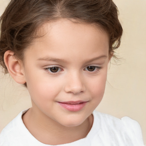 Joyful white child female with short  brown hair and brown eyes