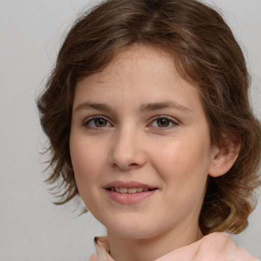 Joyful white child female with medium  brown hair and brown eyes