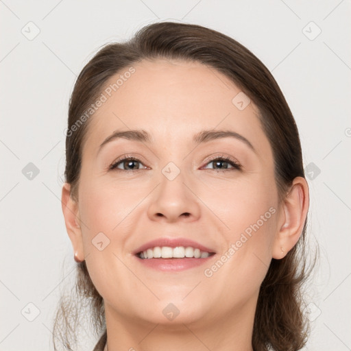 Joyful white young-adult female with medium  brown hair and grey eyes