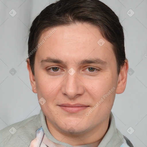 Joyful white adult male with short  brown hair and brown eyes