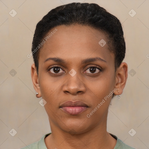 Joyful black young-adult female with short  brown hair and brown eyes