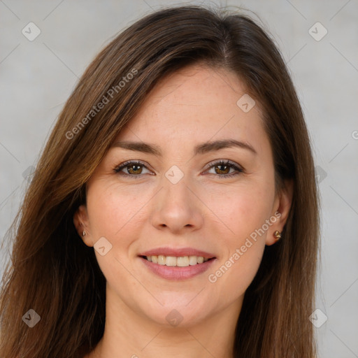 Joyful white young-adult female with long  brown hair and brown eyes