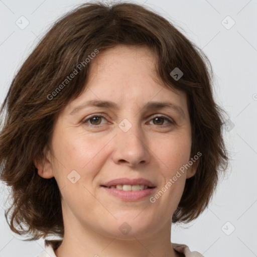 Joyful white young-adult female with medium  brown hair and green eyes