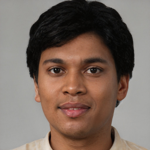 Joyful asian young-adult male with short  black hair and brown eyes