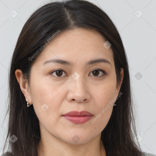 Joyful asian young-adult female with long  brown hair and brown eyes