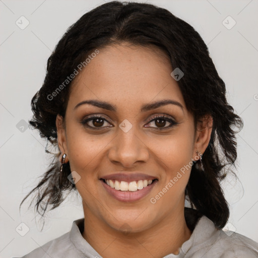 Joyful black young-adult female with medium  brown hair and brown eyes